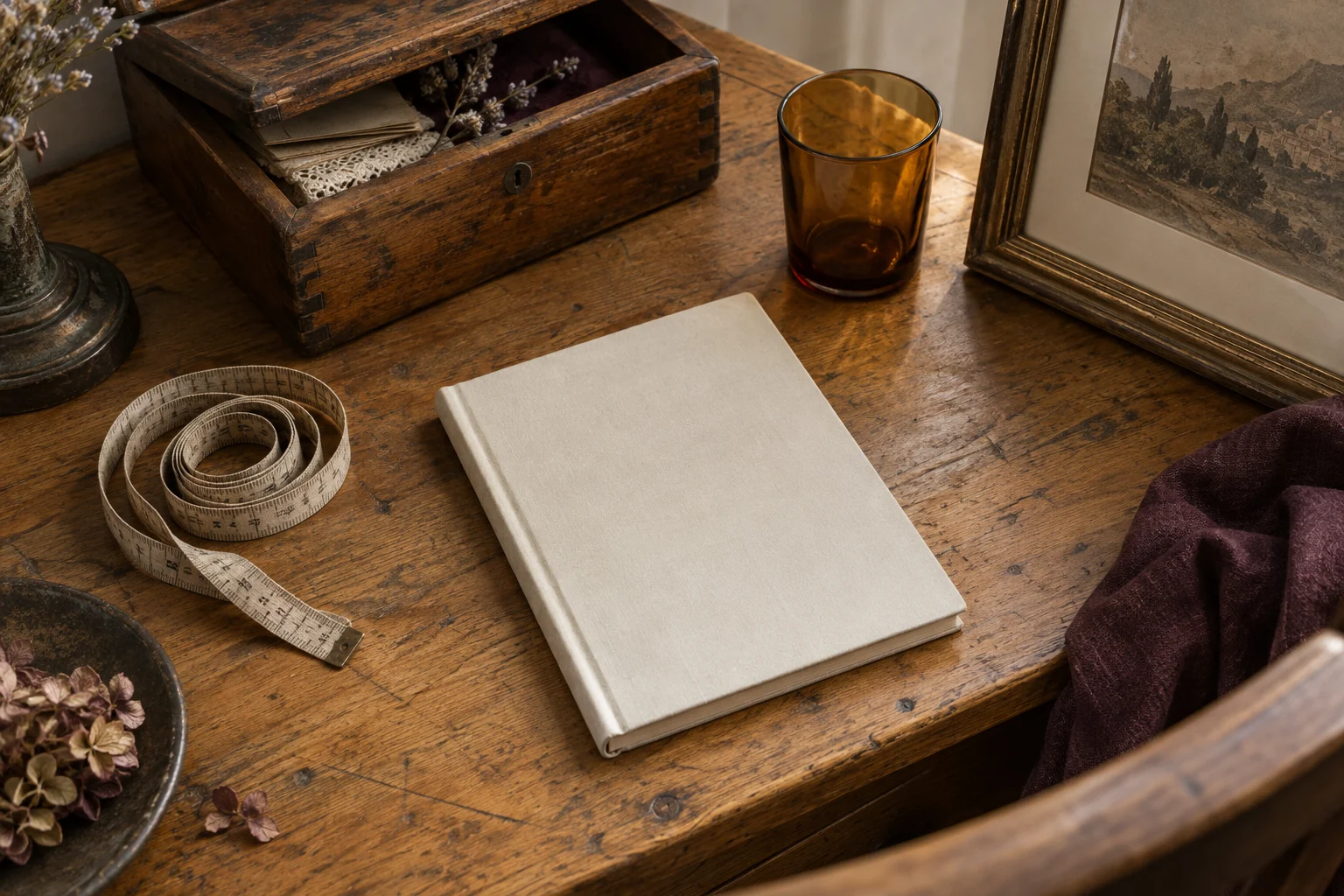 Illustrative notebook, tape measure and small vintage objects